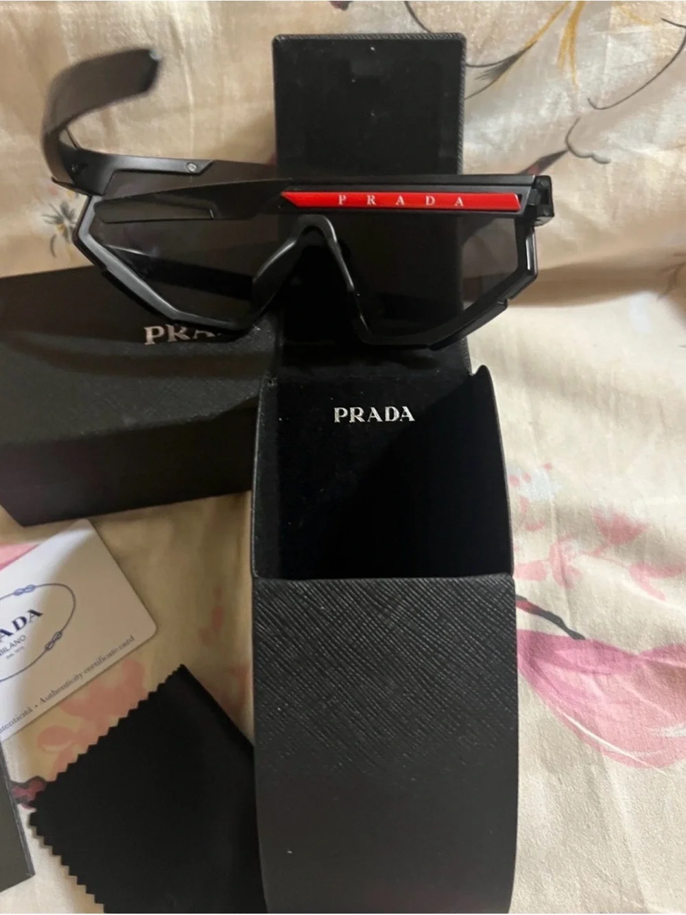 Prada Shield Sunglasses in Black with Red Brow Accent
